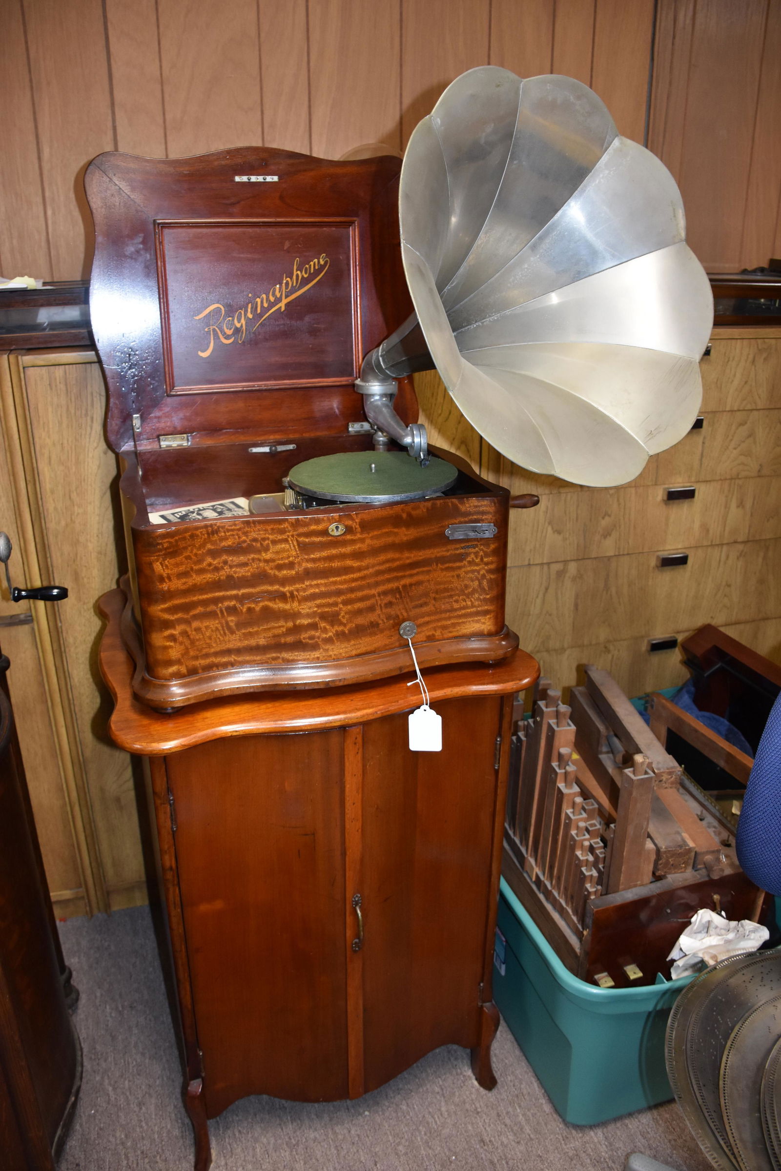 Reginaphone Style 155 Music Box & Cabinet: Mahogany 15-1/2" machine with serpentine case and matching base disc storage cabinet. Short bedplate, no broken teeth. Includes the tone arm, phonograph turntable, 12 discs, and the crank. Pictured on