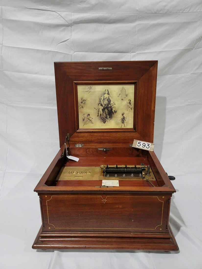 Regina 15-1/2" Disc Music Box: Pine striped inlaid mahogany case. Double comb with no broken teeth. SN-55135. 12 discs included