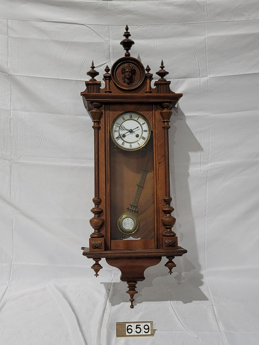 Wood Wall Clock: Has pendulum. No key. Porcelain Dial. 40" tall.