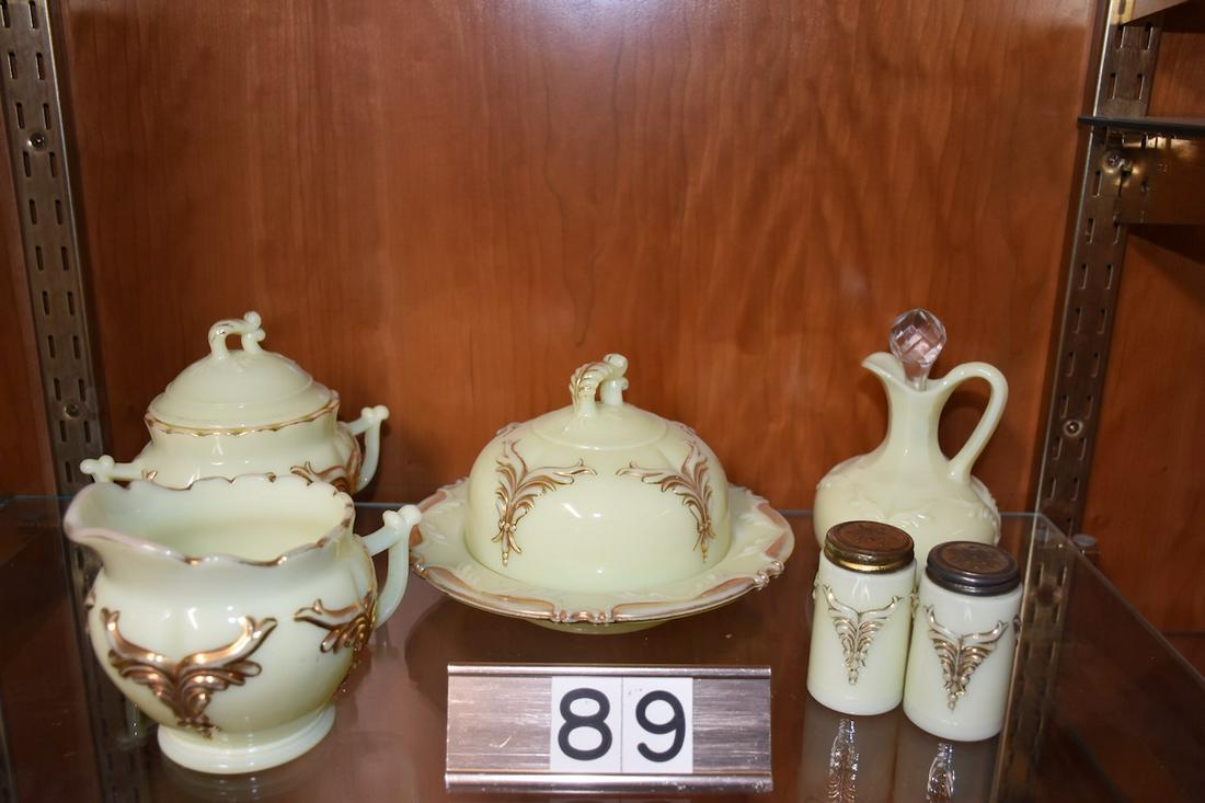 Custard Winged Scroll Table Set: Custard Glass â€“ Winged Scroll pattern table set, Cruet, covered butter, salt and pepper, and cream and covered sugar.