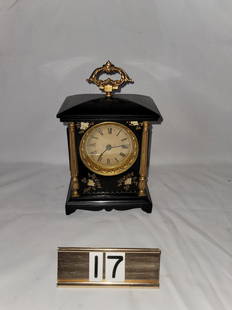 Shelf Clock: Metal Stenciled, maker unknown. 9" tall x 5-1/2" wide.