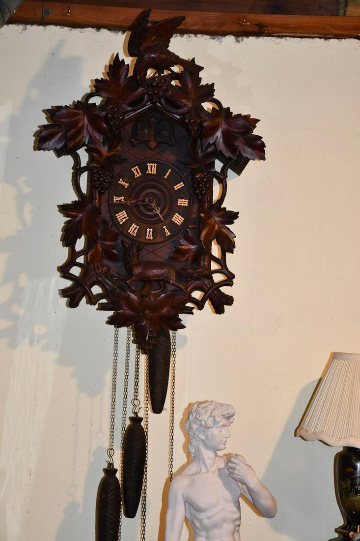 Carved Wall Cuckoo Clock: Triple weight. Carved with animals and birds. Black forest style example
