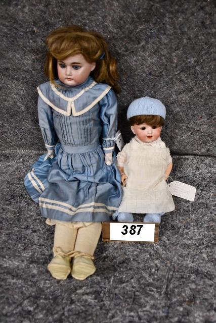 2 German Bisque dolls: Hertel Schwab Character baby #152 - 12" and AM 3200 bisque doll that measures 23" with sleep eyes, OM and teeth.