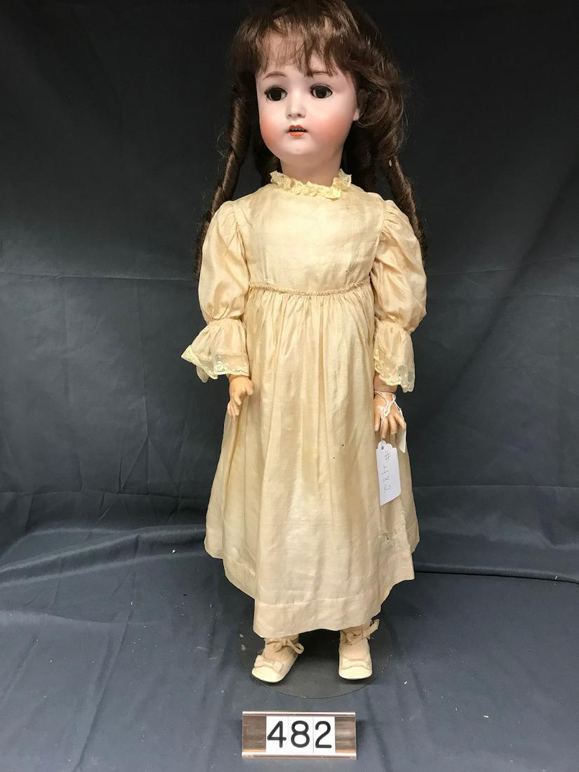 Bisque Doll: Made in Germany. Marked 136, 13. Measures 28". Open mouth with teeth.