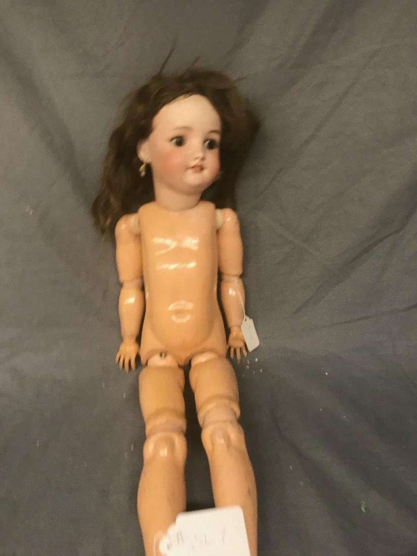 Simon & Halbig Bisque head Doll: Composition body, 24" tall. Sleep eyes, open mouth with teeth. Pierced ears. Body marked Handwerck.