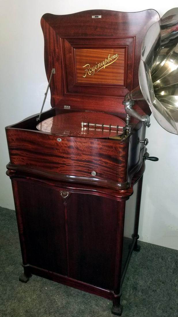 Reginaphone Style 139 20-3/4" Disc Music Box with Matching cabinet: Nine panel nickel horn, tone arm, turntable and cabinet. No broken teeth. Previously restored in excellent condition. This is an impressive outfit. This is a opportunity to own one of the best out the