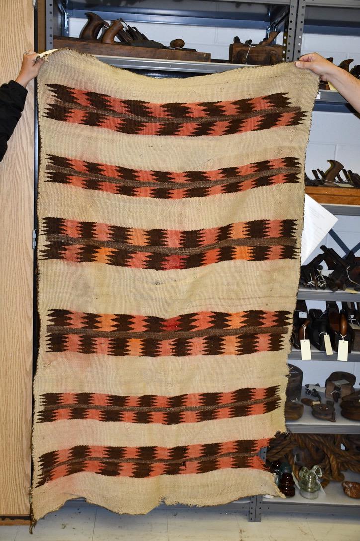Large Navajo Indian Blanket or Rug: 69" long x 44" . Loss to corner, etc.