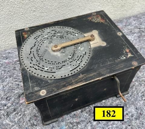 "Diana" Organette: Mfg. by Phoenix Musikwerke, Leipzig. Plays 6.25" Metal discs. One disc included. 10"x8"x5"