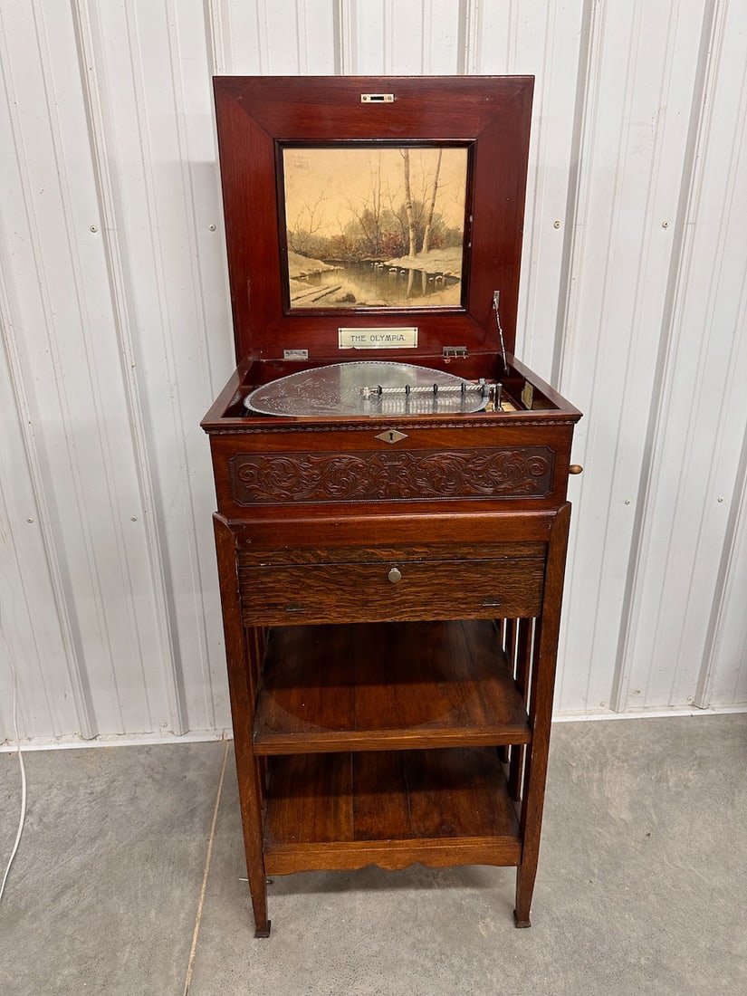 Criterion / Olympia 15.75" Disc Music Box: Single comb with no broken teeth. The cabinet has been altered to fit in a floor stand. The mechanism does work. 6 discs included