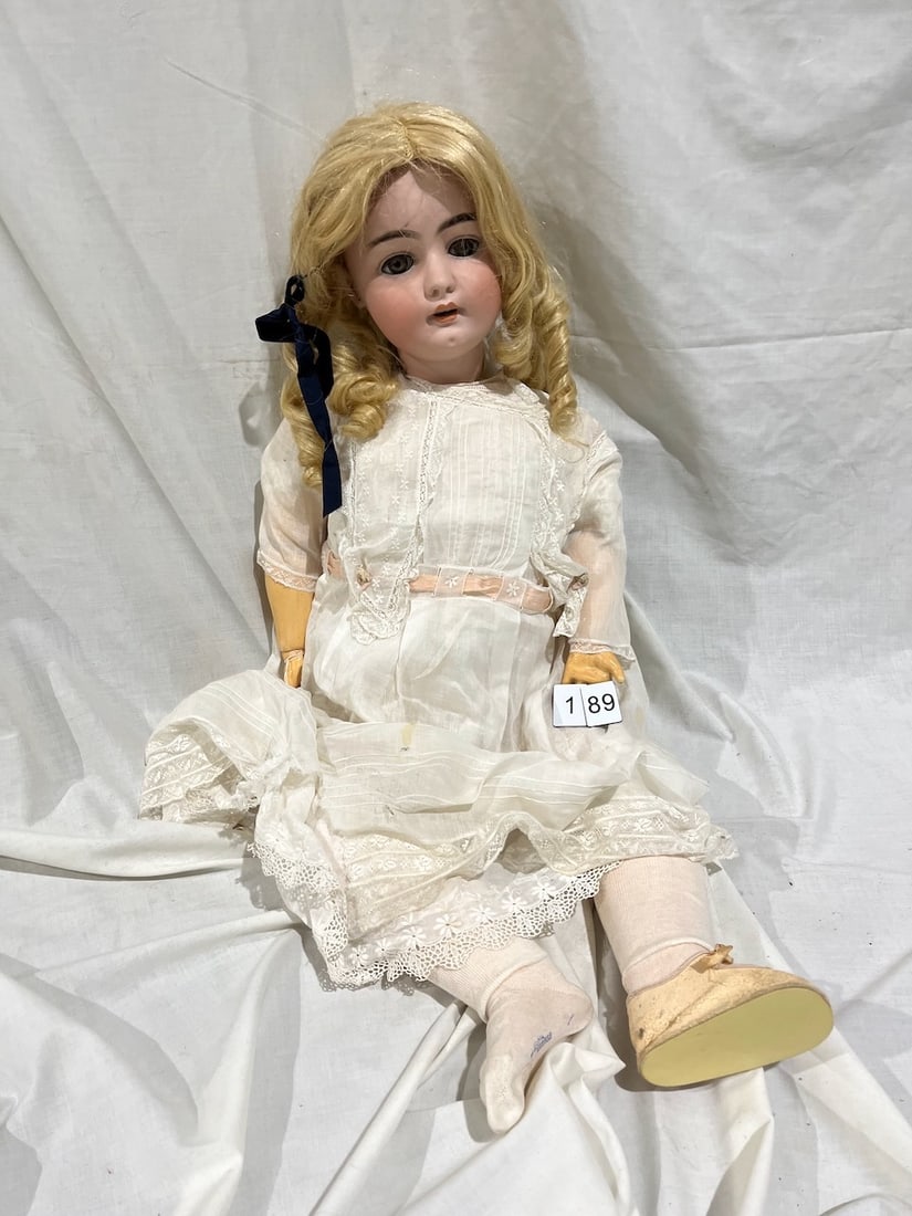 Simon & Halbig Bisque Doll: Marked S & H 1079. DEP. Germany. 16-1/2. Glass eyes, OM with teeth, jointed composition body. 34"