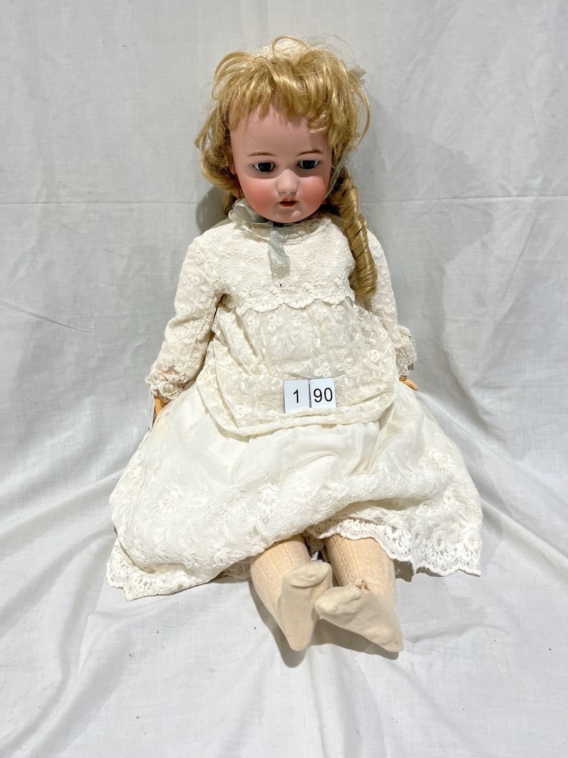 Simon & Halbig Bisque Doll: Marked S&H. DEP. 1079. Germany. 15. Glass eyes, OM with teeth, pierced ears, jointed composition body. 32"