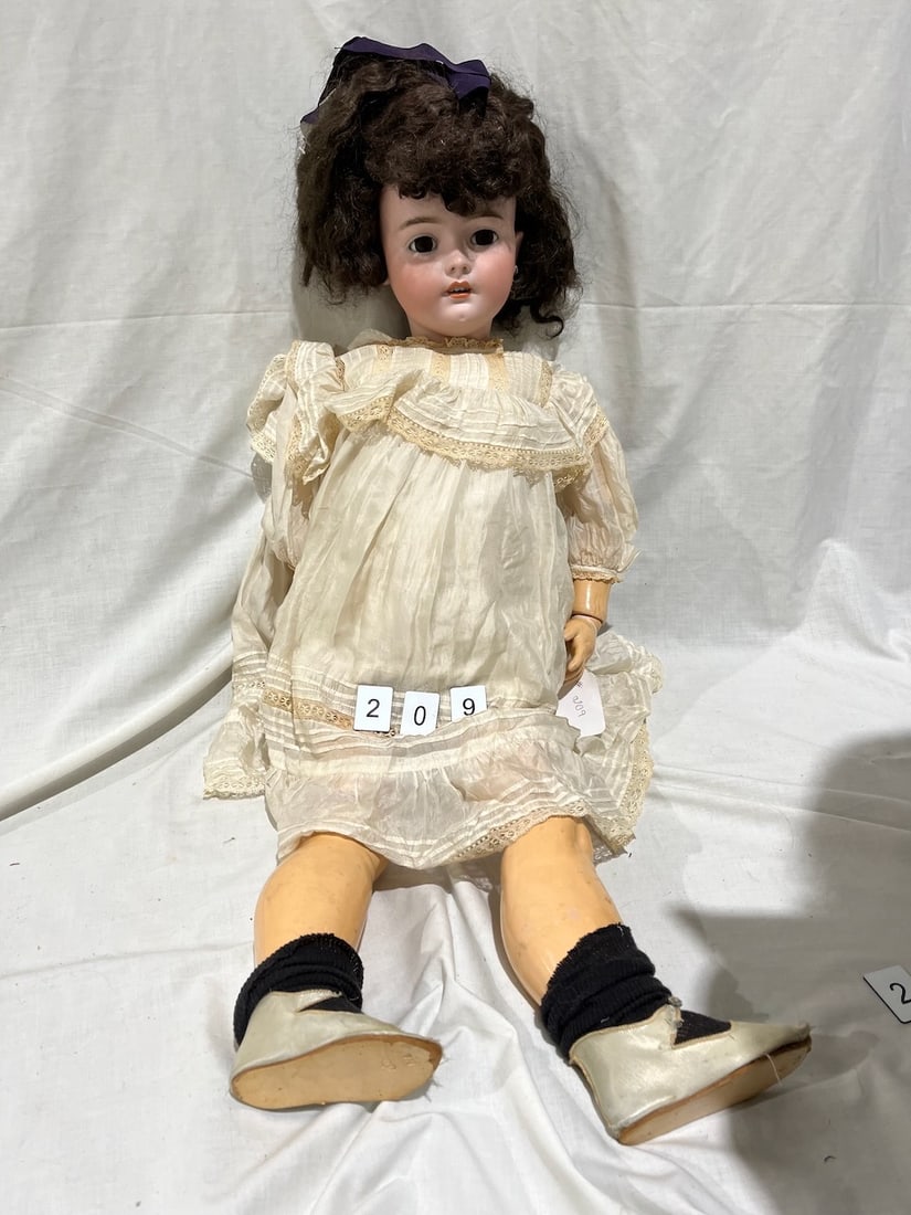 Handwerck Bisque Doll: Germany. Simon & Halbig. Glass eyes, OM with teeth, pierced ears, jointed composition body. 35"