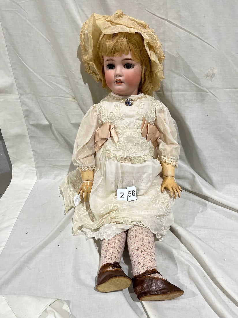 Halbig Bisque Doll: 1249. German. S & H. 14-1/2 Glass eyes; OM with teeth; pierced ears; 32".