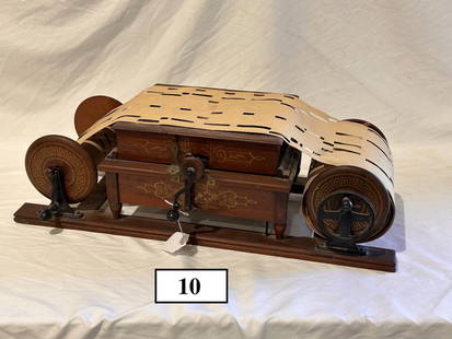 Mechanical Orguinette Paper Roll Organ: Missing belt. 27"w x 12"d x 8"h. One paper roll included