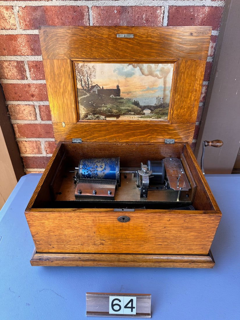 Capital Cuff Music Box Style A: Very good. 5 total cuff's. 4-1/8". No broken teeth. Oak cabinet