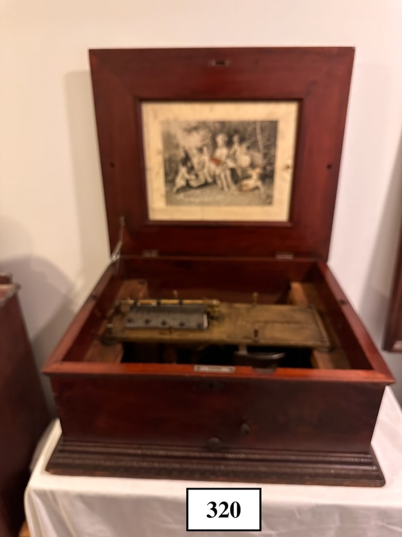Symphonion 14-3/4" Disc Music Box: Mahogany Case, no broken teeth, 1 disc included.
