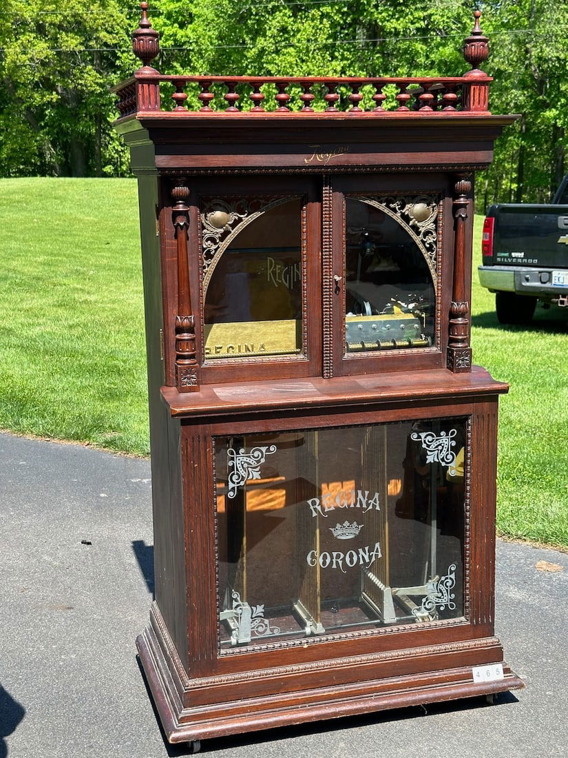 Regina 27" Style 34 Automatic Disc Changer Music Box: Mahogany case with gallery, Orchestral Corona, No broken teeth, 12-27" discs included. Serial no. 46764