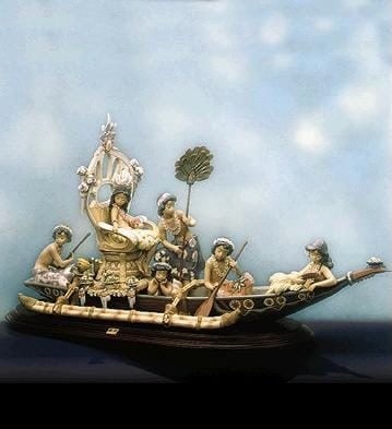 Lladro Hawaiian Ceremony: #01001757. Issued 1992, Retired 2003. 18" tall x 32.75" long. Has original base and COA* Please note the flowered piece off the bow of the bow has a break that is only on the back of the same. The pie