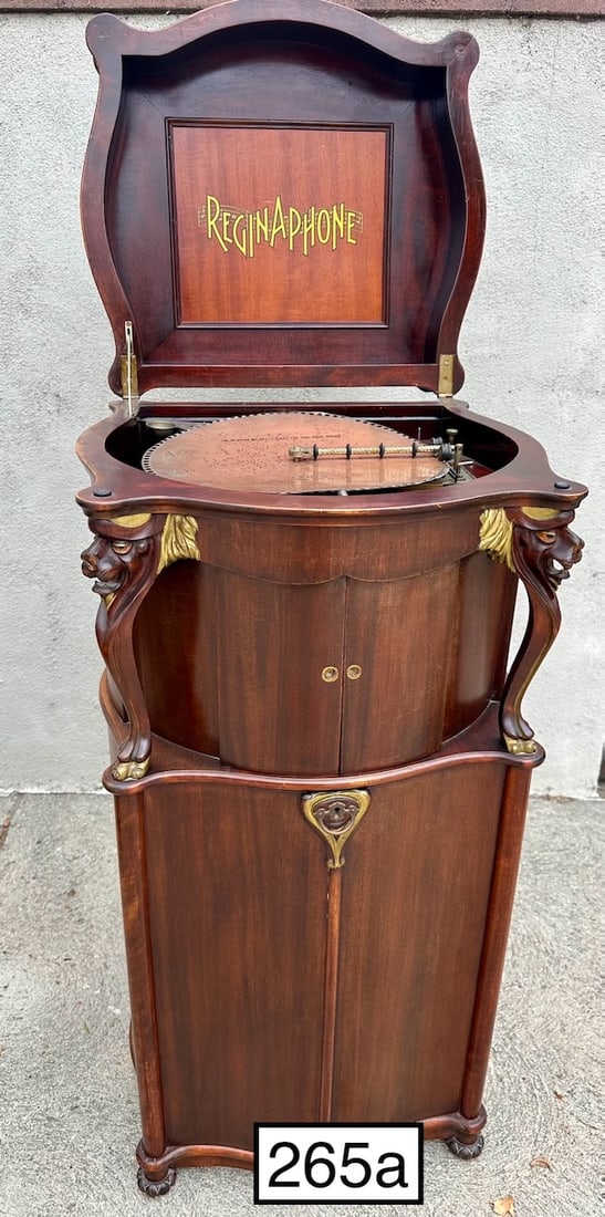 Reginaphone Style 240 Lions Head Combination Music Box and Phonograph: Mahogany Lions Head cabinet, no tonearm or turntable, no broken teeth, 10 15-1/2" music discs included.