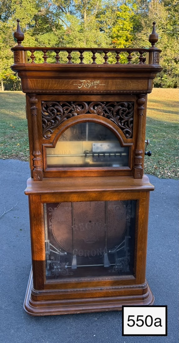 Regina 20-3/4" Dragon Front Automatic Changer Disc Music Box: The Style 31, Oak Cabinet, Has the gallery and finials Double comb with no broken teeth. SN-45083. 12-20-3/4" disc included