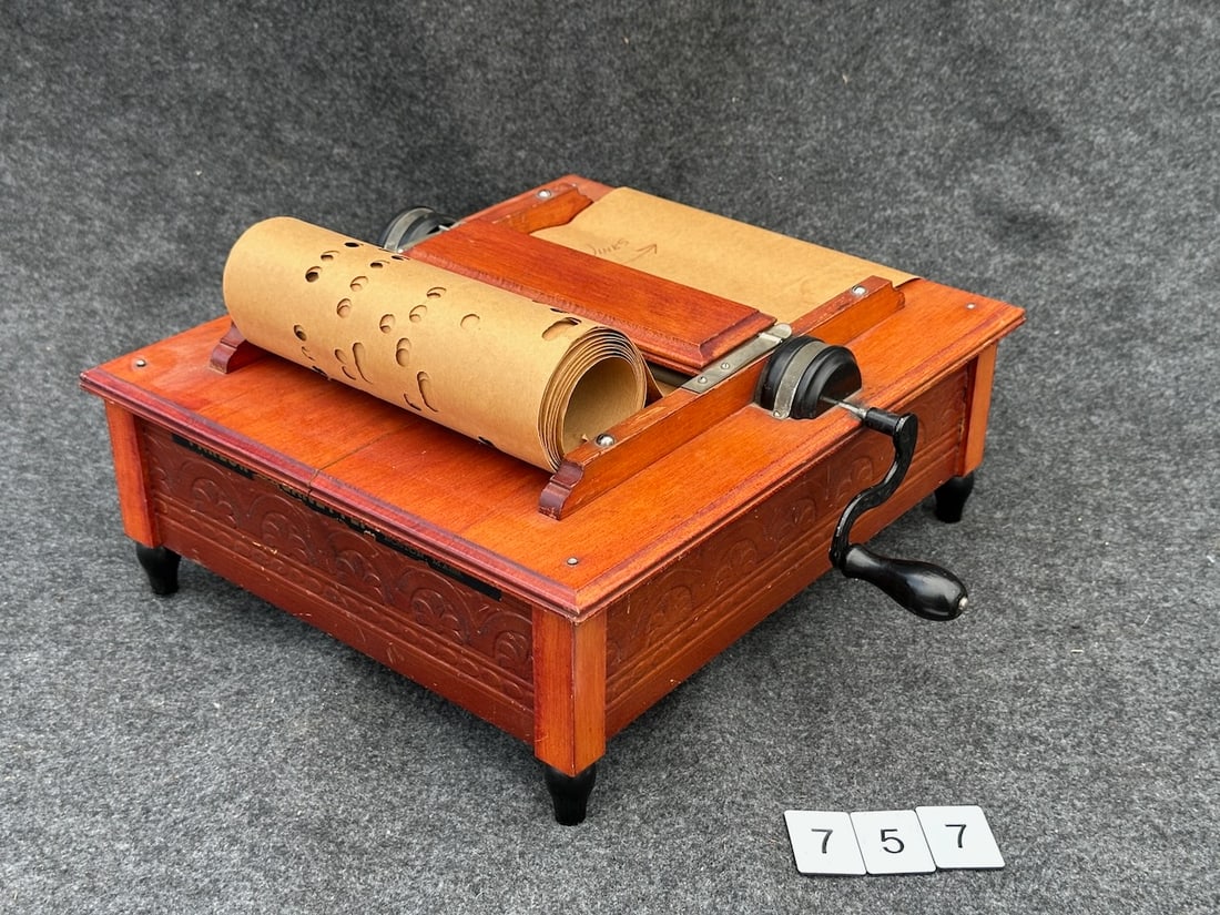 The Parlor Organette: Pressed pattern sides, Made by C.H. W. Bates & Co., Boston. One 14-note music strip.