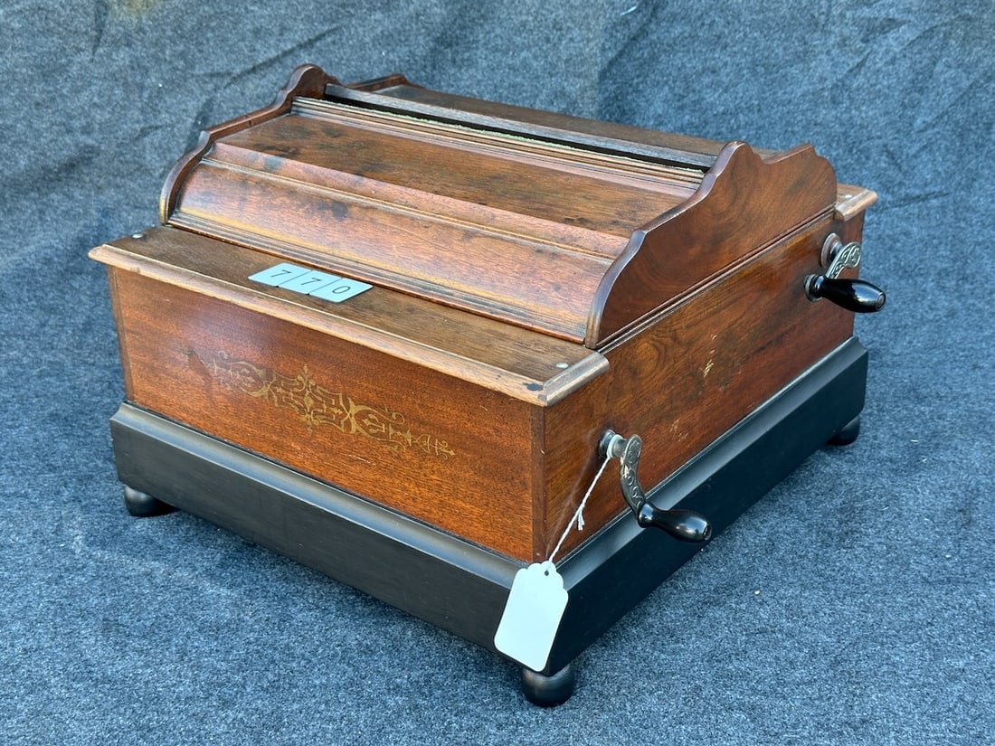 Musical Cabineto Paper Roll Organ: Made by the Mechanical Organette co., New York, one roll included.