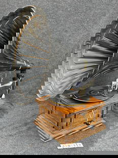 Columbia Rear Mount Disc Phonograph: Fancy oak case, Columbia reproducer, crank and horn.