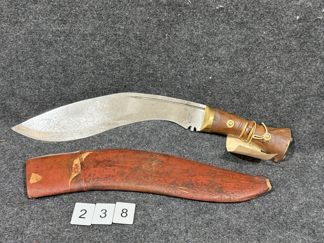 Kukri Nepal Knife: Has sheath. Steel, brass, and wood. 19" overall length