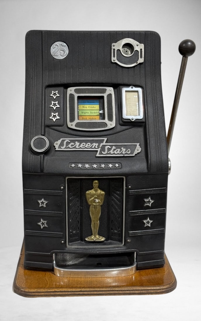 Mills Screen Stars 25¢ Slot Machine: Good Condition, 25" x 17.75" x 16" . Includes key.