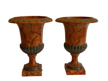 A pair of Cast Iron Urns
