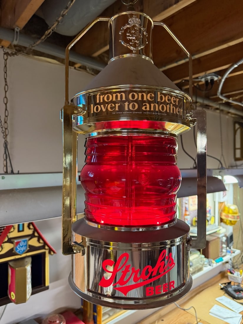 Stroh's hanging lantern: 21" high x 10" diameter, working. Revolves and lights