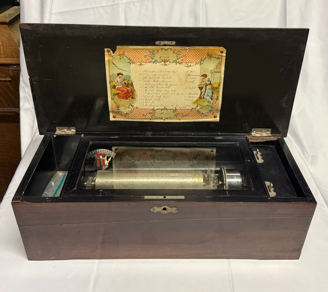 Cylinder Music Box: 12 tune. Has tune card . Incomplete. No winding ratchet