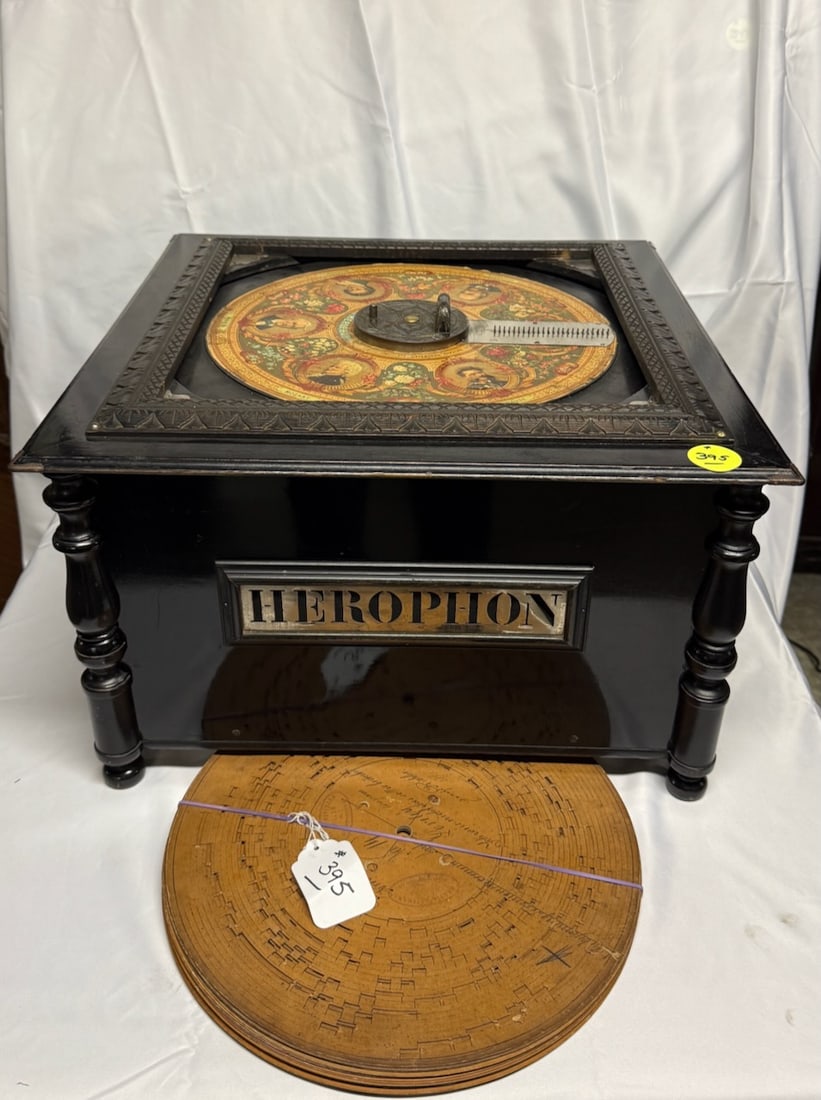 Herophon Cardboard Disc Player: Very good case condition. Missing hold down bar. No crank found yet. Plays a 13" disc.