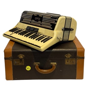 Stonelle Accordion Player with Case.