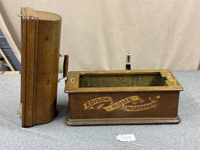 Edison Home Phonograph Cabinet: Long case. Banner front. No works. Has crane bracket