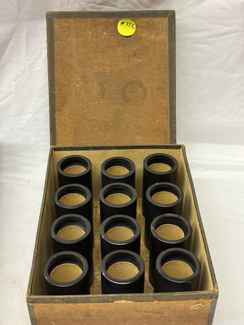 A 12-place box of Black Wax Cylinders: In pegged shipping box.