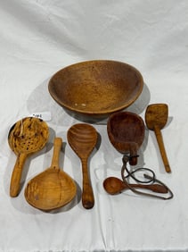 A group of carved wooden ware items