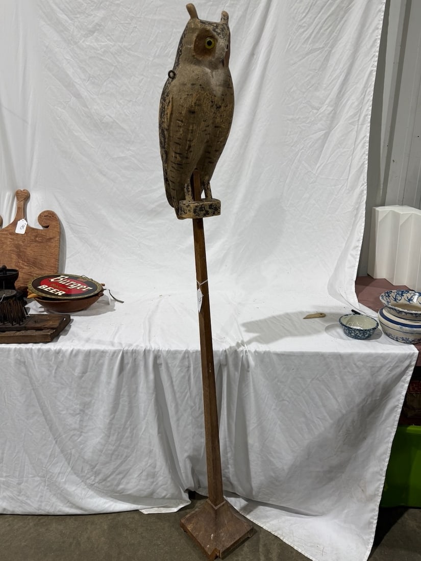 A rare and Excellent Carved Owl on stand: The owl also has eye hooks and appears it may have been hung at one time.