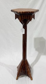 A carved wooden Folk Art Plant stand