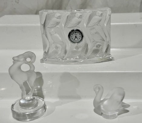 3 Signed Lalique Pieces: Including a clock with a Lalique Marked Mechanism; a Gazelle & Swan; Clock measures 3-3/4" x 4-1/2" and has owls embossed on same