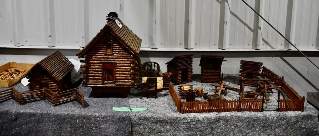 A Fantastic Folk Art Set of Buildings: Including Cabin, Outbuildings, Fencing, Outhouse, Wellhouse and some furniture; Largest piece measures 19 x 16 x 24