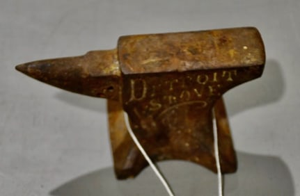 A miniature Anvil marked "Detroit Stove Works"
