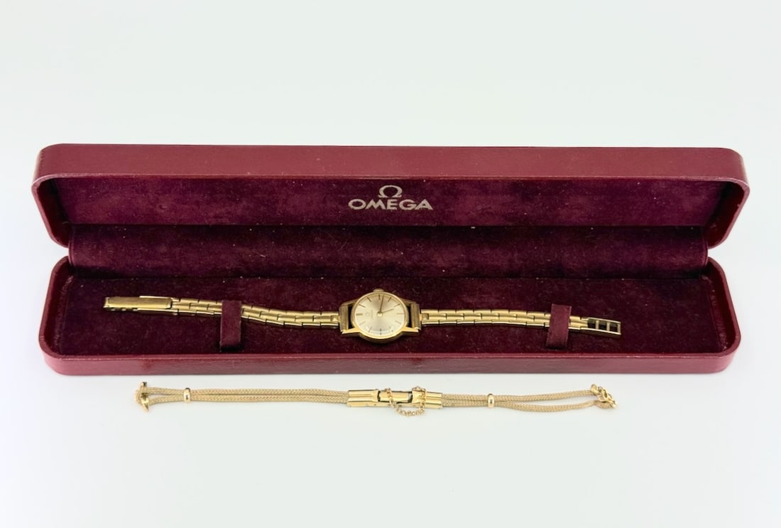 Omega #628 Ladies Wristwatch: 14k Watch and band, 17j, 2 adj. Original box and strap. C1961. Total Weight with bands. 30.6g