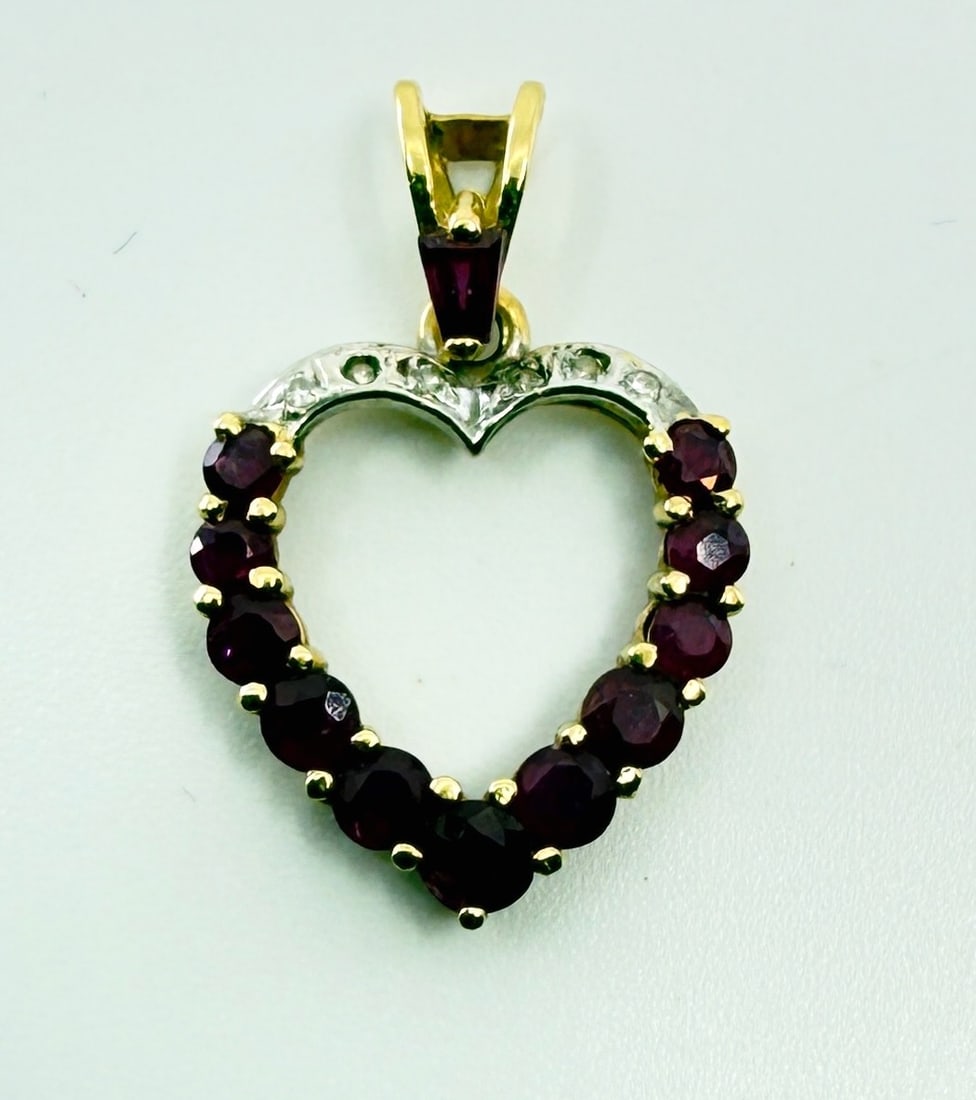 14K Heart Pendant: Missing one clear stone. Total Weight 1.8g