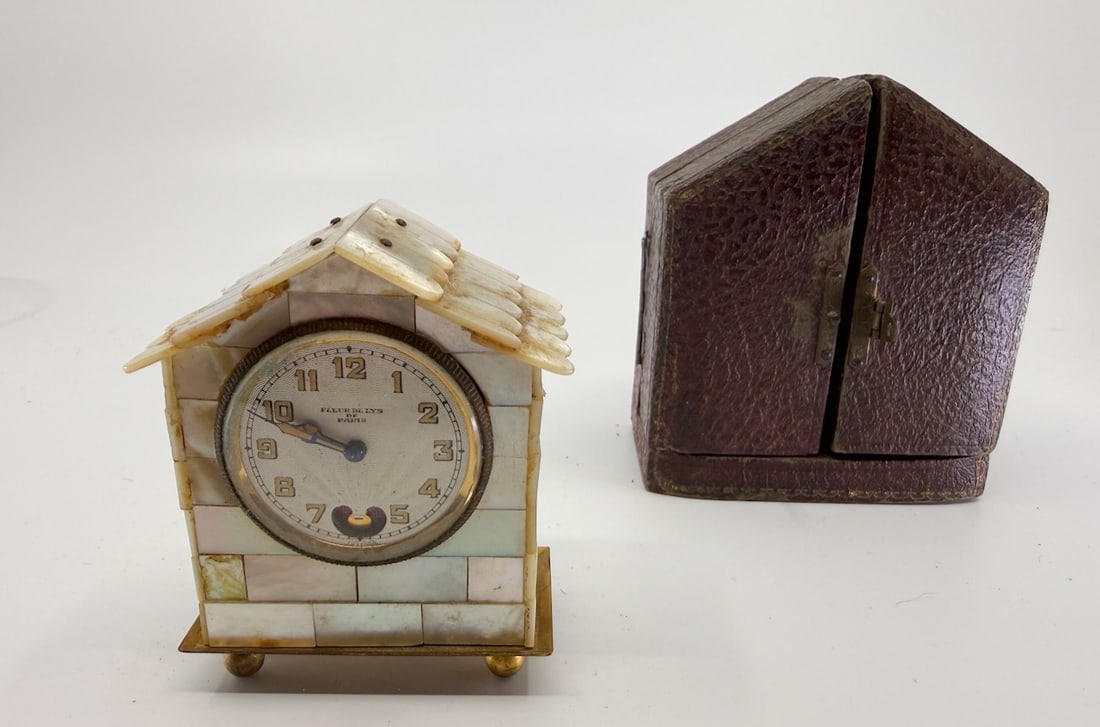 Fleur De Lys Paris Clock: Beating heart, mother pearl, leather case, need service, missing foot. 2-1/8"w x 1" x 2-1/2"