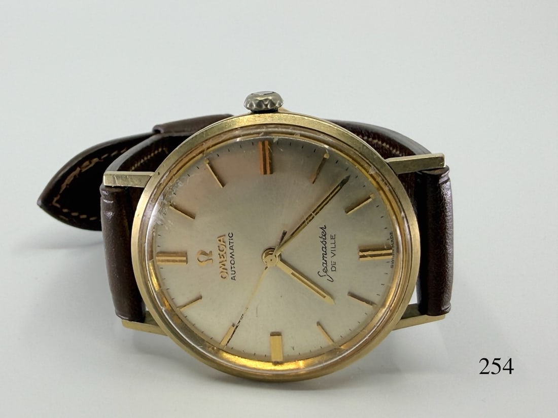 Omega "Seamaster" DeVille Automatic Wristwatch: 14k , engraved 25yr service equipment division. Total Weight with band 35.6g