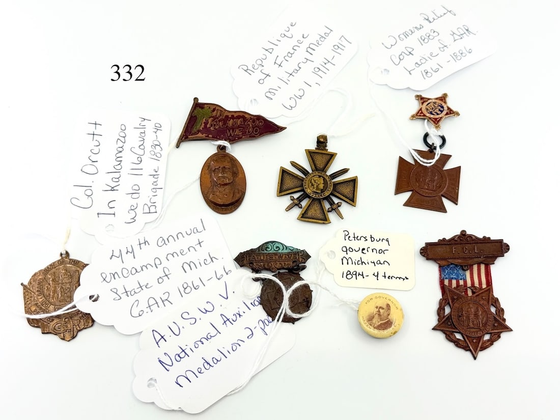Group of medal and pinbacks: G.A.R 44th Annual Encampment, G.A.R. Ladies medallion/ribbon 1886, France military medal, Woman's relief corp 1883, Col. Orcutt Kalamazoo, Peterburg for Governor MI 1894, and A.U.S.W.V. medallion. 7 T