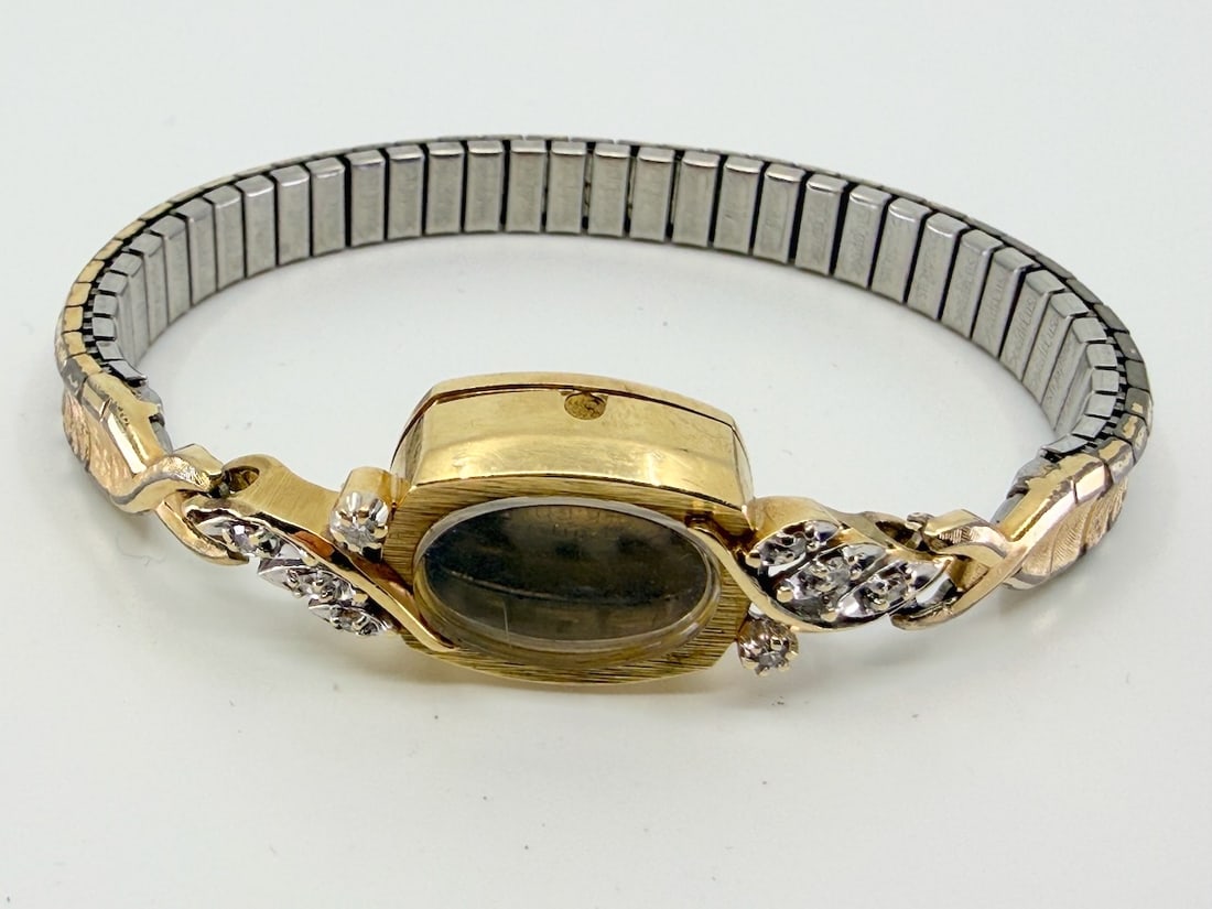L & W Ladies Wristwatch Case and Band Only: Marked 14k Bulova on back, with 8 diamonds. Total Weight 13.6g