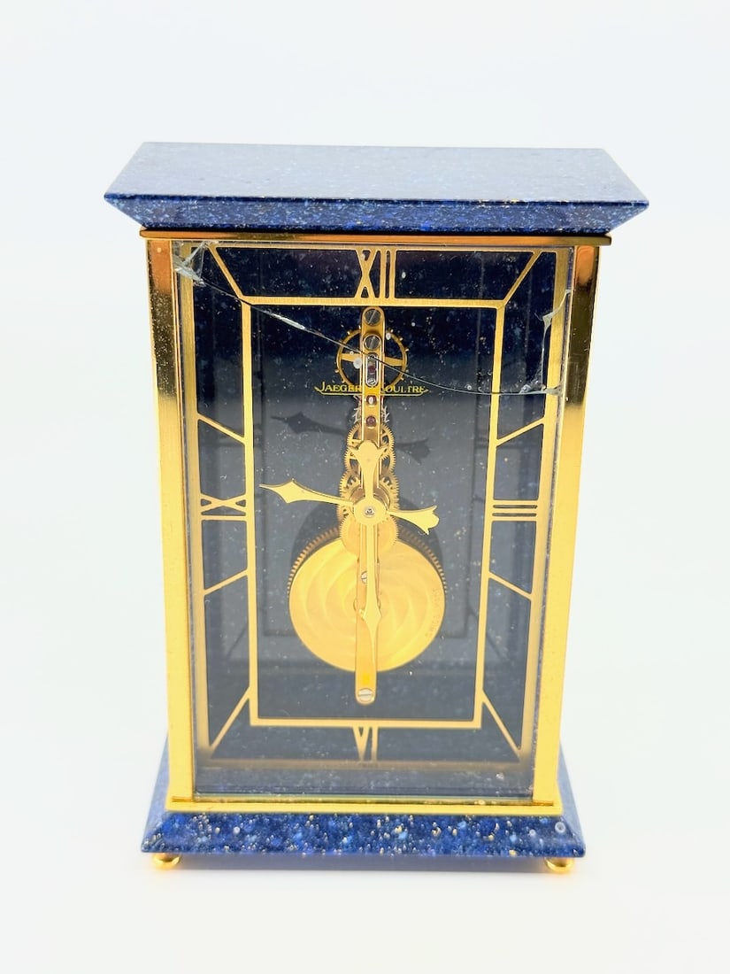Jaeger LeCoultre Skeleton Desk Clock: Plate blue and gold, glass cracked, 3" x 1-1/2" x 4-3/4"t
