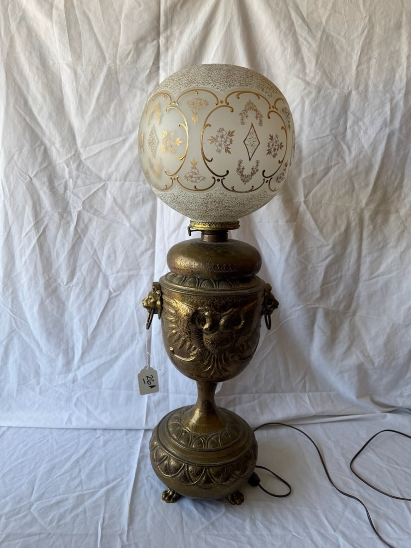 Large Brass Base GWTW Lamp: Embossed base depicts a Phoenix Lion's Head Handle & Claw Feet w/gold decorated ball shade; 36" tall